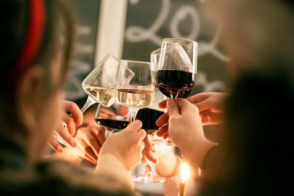 group toasting wine glasses